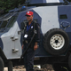 A Pakastani security stands next to an armored vehicle outside a U.S. consulate. (Arif Ali/AFP/Getty Images)